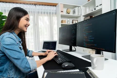Young Asian in IT creating with typing online information on pc. Stratagem. 스톡 사진