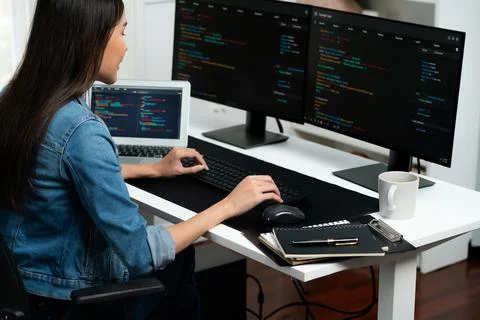 Young Asian in IT creating with typing online information on pc. Stratagem. 스톡 사진
