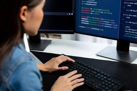 Young Asian in IT creating with typing online information on pc. Stratagem. 스톡 사진