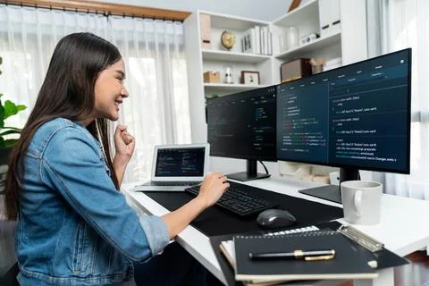 Young Asian in IT creating with typing online information on pc. Stratagem. 스톡 사진