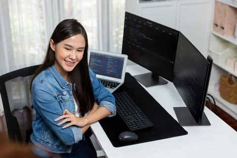 Young Asian in IT developer looking out surround application data. Stratagem. Foto stock