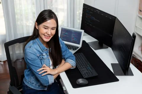 Young Asian in IT developer looking out surround application data. Stratagem. 스톡 사진