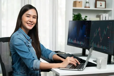 Young Asian in IT developer looking at camera to present on pc. Stratagem. 스톡 사진