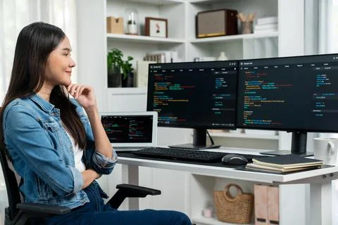 Young Asian in IT developer looking online information on pc to pose. Stratagem. 库存照片