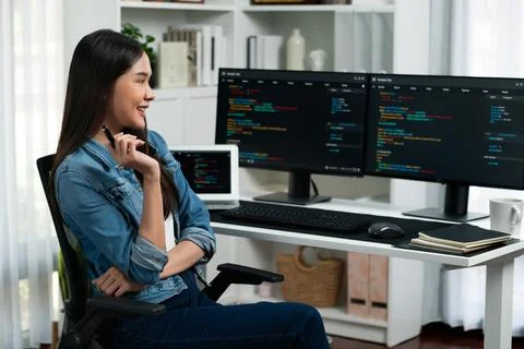 Young Asian in IT developer looking online information on pc to pose. Stratagem. 스톡 사진