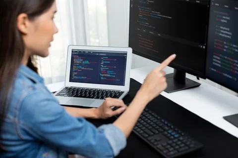 Young Asian in IT developer pointing online information on pc. Stratagem. 스톡 사진