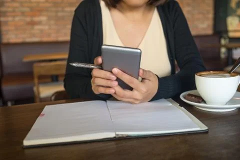 Young Asian lady using smartphone Stock Photos