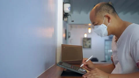 Young Asian male using tablet working online indoor. 動画素材 170303863