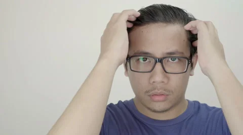 Young Asian Man Arranges His Hair Using Hand in front of Camera 4K Resolution Stock Footage 59948768