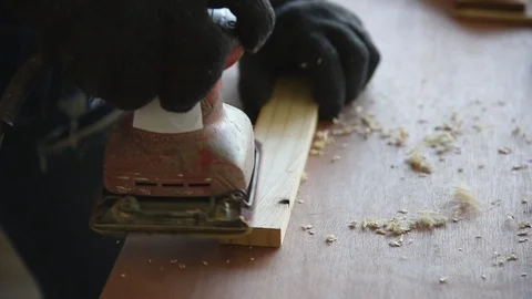 Young Asian man carpenter worker use grinder machine to grind wood Stock Footage 124883603