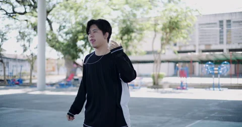 Young Asian man is dancing freestyle under a dome in the park. Stock-Footage 313120097