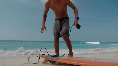 Young asian man do ready surfboard on the beach. Powerful ocean and one man Stock Footage 245022094