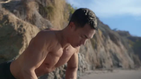 Young asian man does push ups at outdoor training Stock Footage 203836363