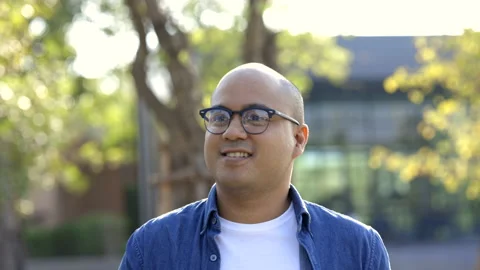  Young asian man drinking cool water from bottle of water in the park. Stock Footage 153446016