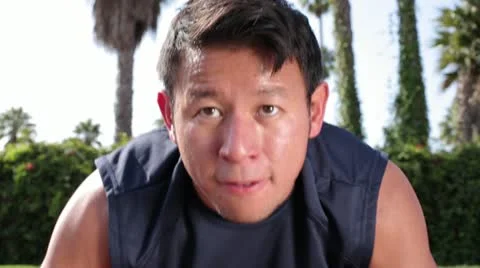 Young Asian Man Exercising Doing Push Ups Facing Shot Stock Footage 16494796