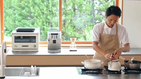 Young asian man in the kitchen. Stock Footage 138441065