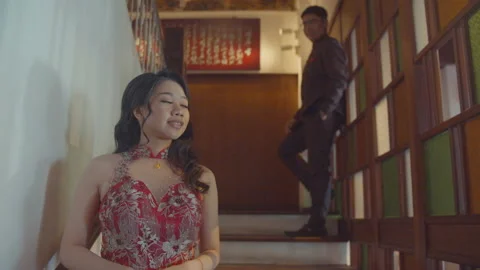 Young Asian Man Looking At His Girlfriend In The Stair Stock Footage 161544838