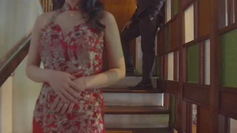Young Asian Man Looking At His Girlfriend In The Stair Stock Footage 161565356