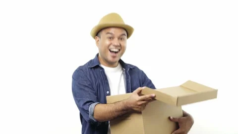 Young asian man open the parcel box and feeling shocked and happy. Casual man lo Stock Footage 144254188