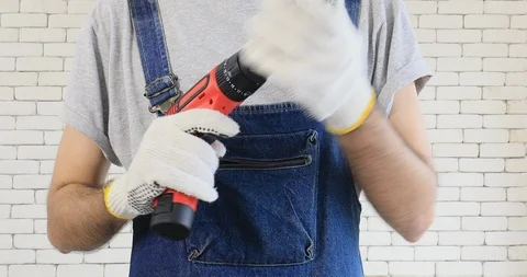 Young Asian man preparing electric drill. Stock Footage 98965876