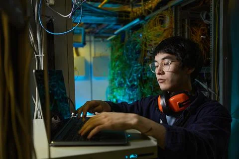 Young Asian Man Programming Server 스톡 사진