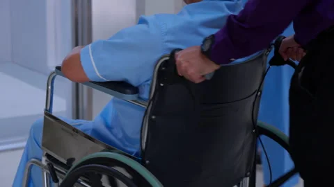 Young asian man pushing button with elevator while elderly father sitting o.. Video stock 270803335