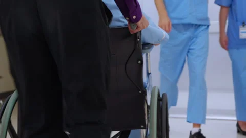 Young asian man pushing button with elevator while elderly father sitting o.. Stock Footage 273502223