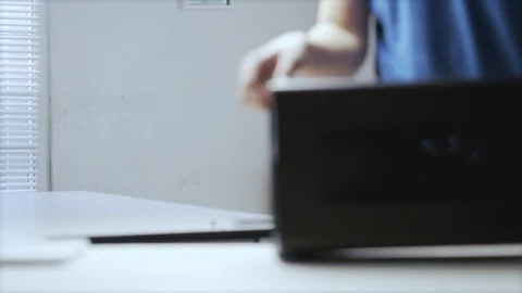 A young Asian man put the external GPU device on a  table  Video stock 129725770