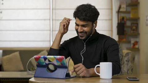 Young Asian man smiling,using digital tablet for internet and social media. 動画素材 155200471