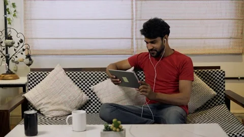 Young Asian man smiling,using digital tablet for internet and social media. Stock-Footage 155576635