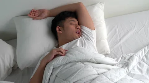 Young Asian man snoring While sleeping in bed. Stock Footage 156639271