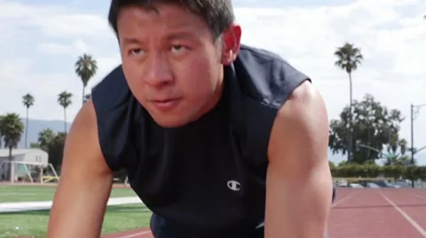 Young Asian Man at the Starting Line Stock Footage 16505481