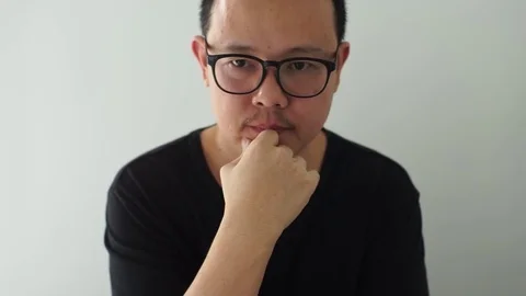 Young asian man thinking expression Stock Footage 83870573