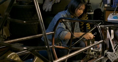 Young Asian Mechanical Engineers Working in Studio Workshop. Video stock 115286804
