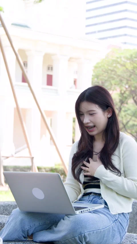 Young Asian Student Having a Video Call on Laptop at University Campus Stock Footage 334165264