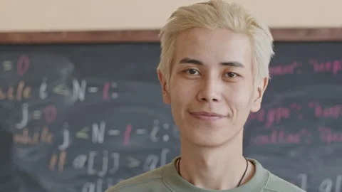 Young Asian Student Posing on Camera in College Classroom Stock Footage 257063029