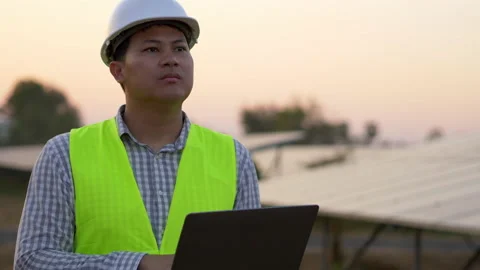 Young Asian Technician Engineer man use laptop computer while check efficiency Stock Footage 198121550