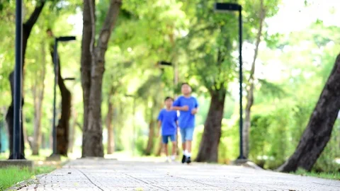 Young Asian two boy running together in a park Stock Footage 88456787