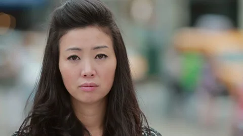 Young Asian Woman in city sad crying face portrait Stock Footage