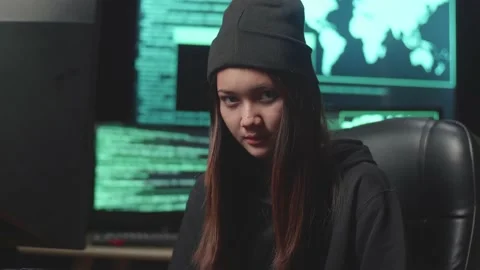 Young Asian Woman Hacker Using Computer Hacking And  Looking, Pose To Camera Stock-Footage 161456077
