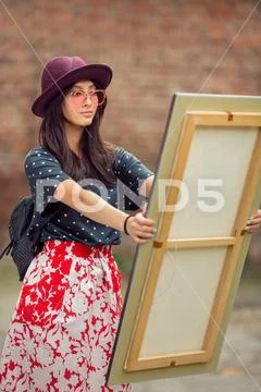 Young Asian woman portrait with painting Stock Photos