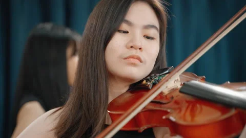 Young Asian woman practicing playing the violin Stock Footage 276574570