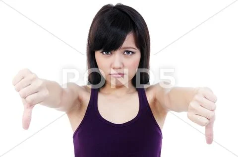Young asian woman showing thumb down sign Stock Photos