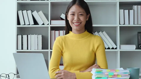 Young asian woman using computer and financial documents, accounting in home Stock Footage 242737547