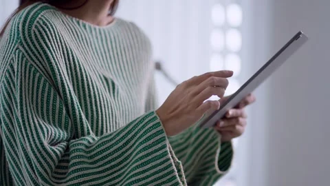Young Asian woman using digital tablet with stylus pen for online studying .. Stock Footage 342533720