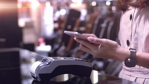Young Asian Woman Using Mobile Phone Smart Payment Stock-Footage 117403744