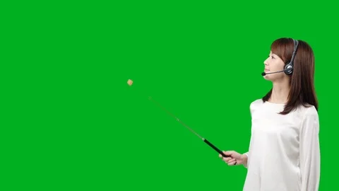Young asian woman using pointer. Green background for Chroma keying. Video stock 101771427