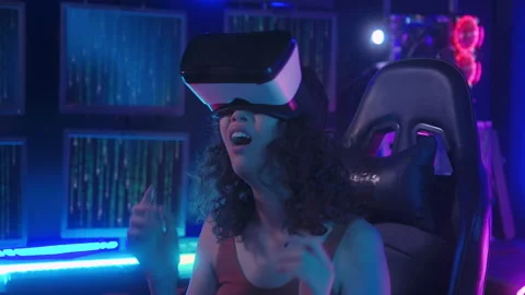 A young Asian woman using virtual reality  , vr box to play online game or .. Stockbeeldmateriaal 232946686