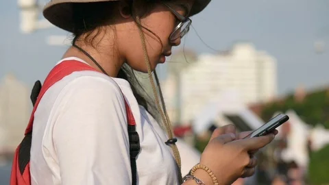 Young asian women using mobile chatting online. Female using smartphone searc Stock Footage 100327061