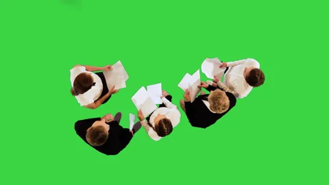 Young associates with papers in their hands on a Green Screen, Chroma Key. Stock Footage 219467354